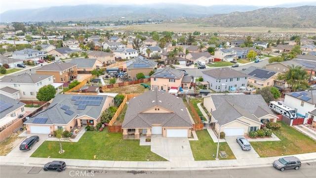 aerial view featuring a mountain view and a residential view