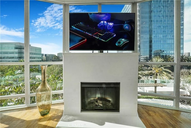 3141 Michelson Dr Unit 508, Irvine, CA 92612 - detailed view of wood finished floors and a fireplace with flush hearth