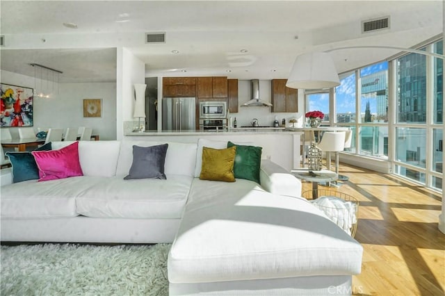 3141 Michelson Dr Unit 508, Irvine, CA 92612 - living room featuring light wood-style floors