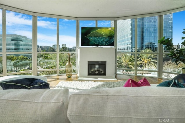 3141 Michelson Dr Unit 508, Irvine, CA 92612 - living room with floor to ceiling windows, wood finished floors, and a fireplace