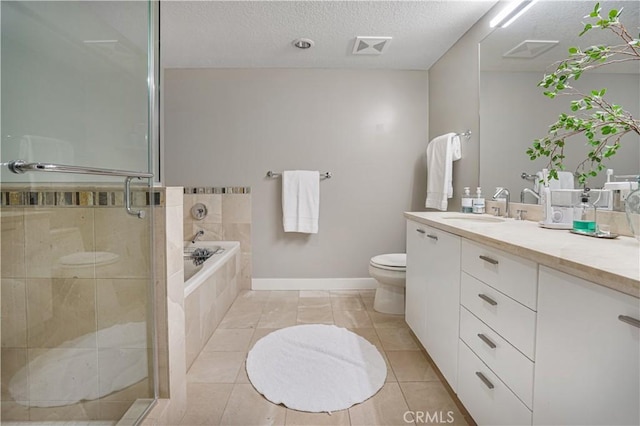 3141 Michelson Dr Unit 508, Irvine, CA 92612 - bathroom featuring vanity, toilet, a garden tub, a shower stall, and a textured ceiling