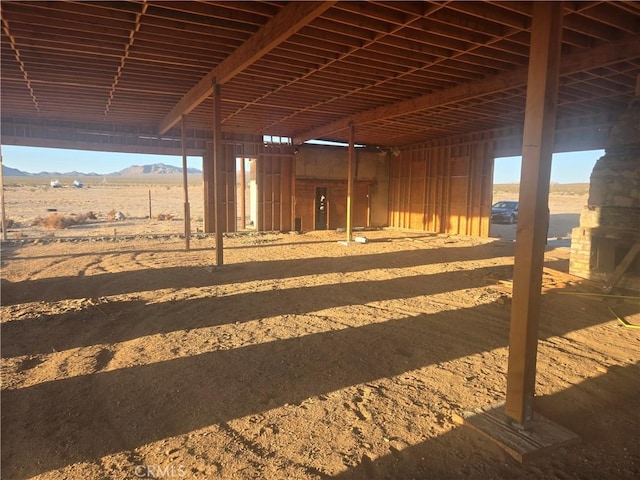 view of horse barn with a mountain view