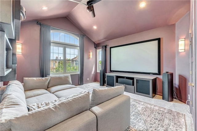 home theater with ceiling fan, light colored carpet, vaulted ceiling, baseboards, and recessed lighting