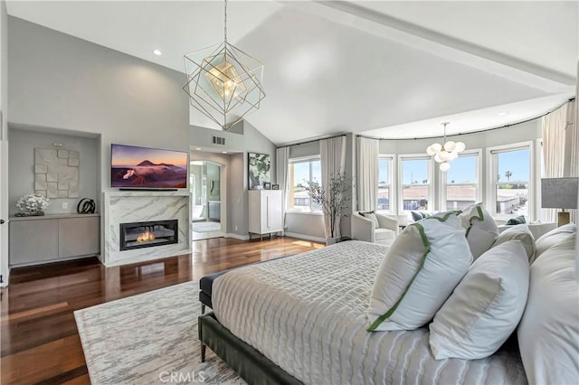 bedroom with visible vents, a chandelier, high vaulted ceiling, and dark wood-style floors