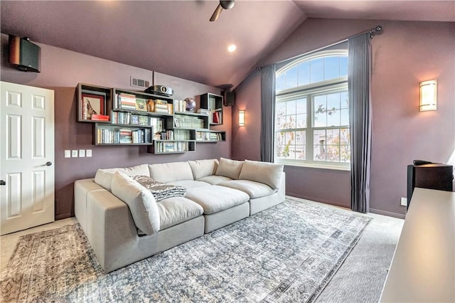 living area featuring ceiling fan, visible vents, and lofted ceiling