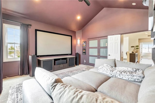 cinema with recessed lighting, carpet floors, plenty of natural light, and high vaulted ceiling