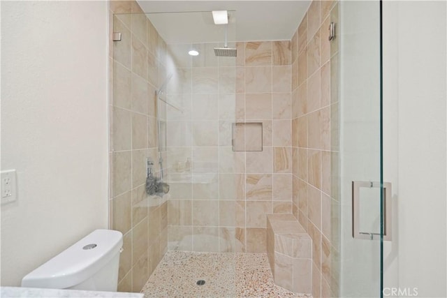 full bath featuring recessed lighting, a stall shower, and toilet