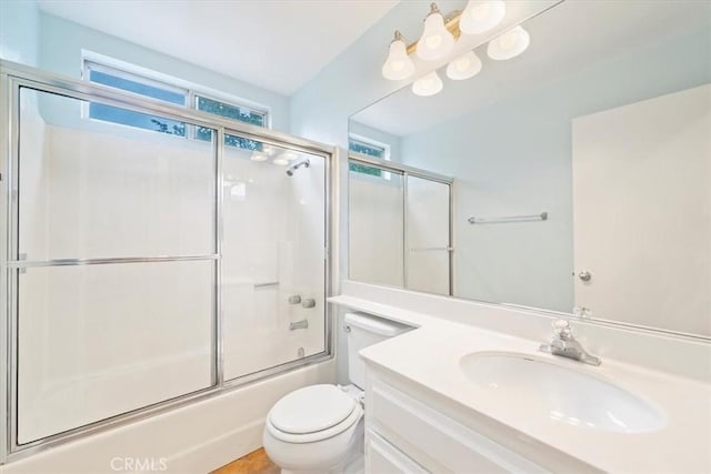1101 Portofino Ct Unit 103, Corona, CA 92881 - full bathroom featuring toilet, combined bath / shower with glass door, and vanity
