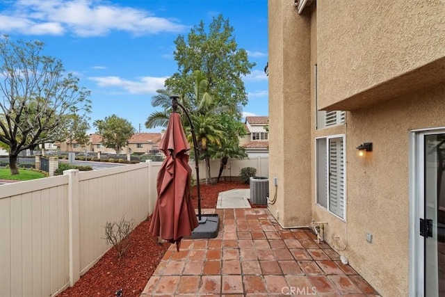 1101 Portofino Ct Unit 103, Corona, CA 92881 - fenced backyard featuring a patio area, central AC unit, and a residential view