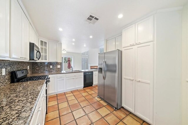 1101 Portofino Ct Unit 103, Corona, CA 92881 - kitchen with stainless steel fridge with ice dispenser, gas stove, dishwasher, tasteful backsplash, and white cabinets