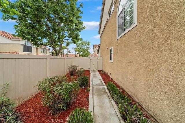 1101 Portofino Ct Unit 103, Corona, CA 92881 - fenced backyard with a gate