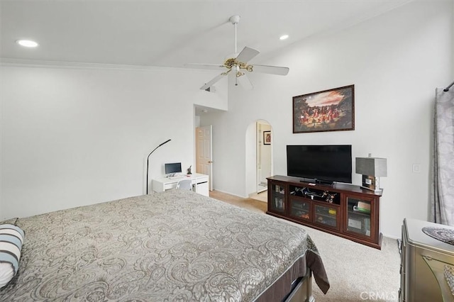 bedroom featuring arched walkways, ornamental molding, and carpet flooring