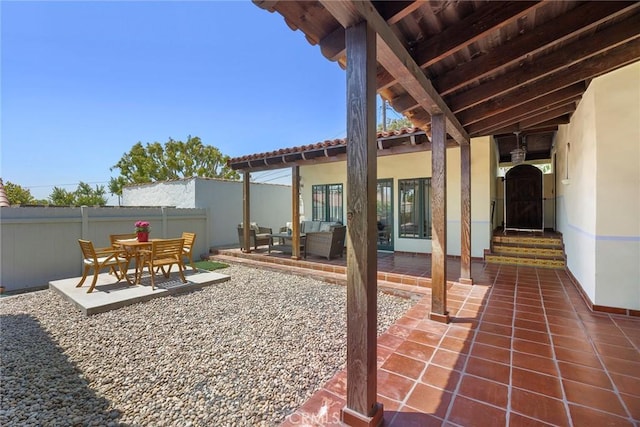 view of patio featuring an outdoor living space and fence
