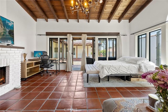 bedroom with access to exterior, a fireplace, beam ceiling, wooden ceiling, and an inviting chandelier