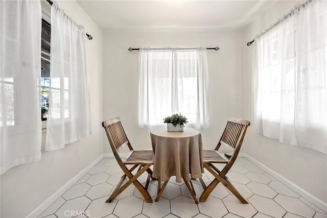 dining space featuring baseboards