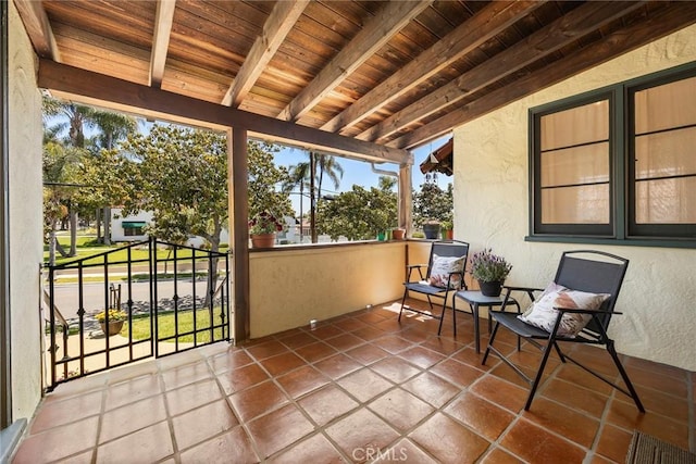 sunroom with beamed ceiling