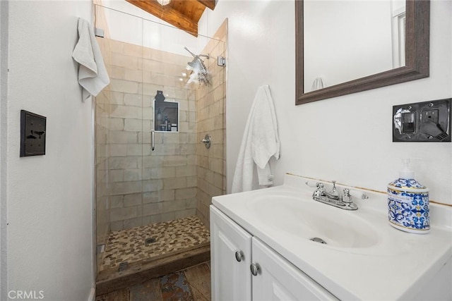 full bathroom featuring a shower stall and vanity