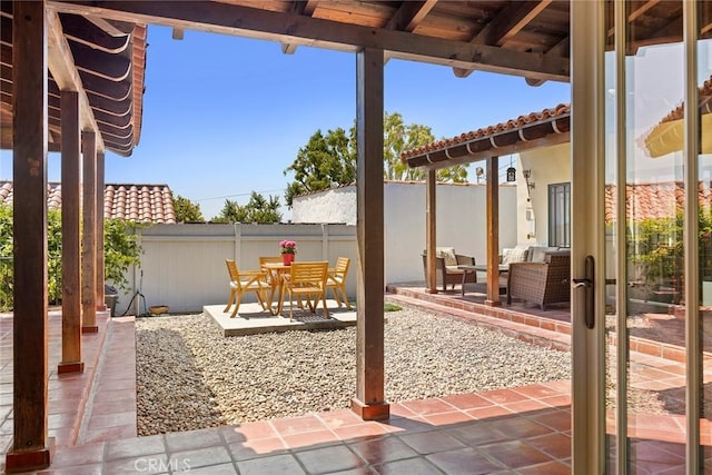 view of patio / terrace featuring fence and an outdoor hangout area