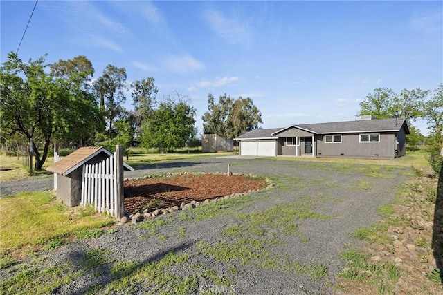 view of front facade featuring a garage, driveway, and crawl space