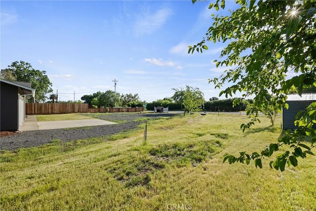 view of yard with a patio and fence