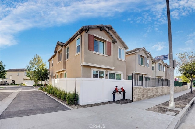 22824 W Olive Way, Canoga Park, CA 91304 - view of side of property featuring a residential view, stucco siding, and fence private yard