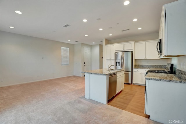 22824 W Olive Way, Canoga Park, CA 91304 - kitchen with stainless steel appliances, visible vents, a center island with sink, and recessed lighting