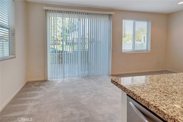 22824 W Olive Way, Canoga Park, CA 91304 - unfurnished dining area with carpet floors and baseboards