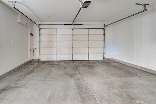 22824 W Olive Way, Canoga Park, CA 91304 - garage with baseboards and a garage door opener