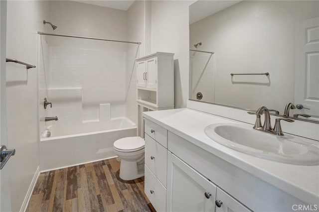 22824 W Olive Way, Canoga Park, CA 91304 - bathroom featuring vanity, toilet, wood finished floors, and bathtub / shower combination