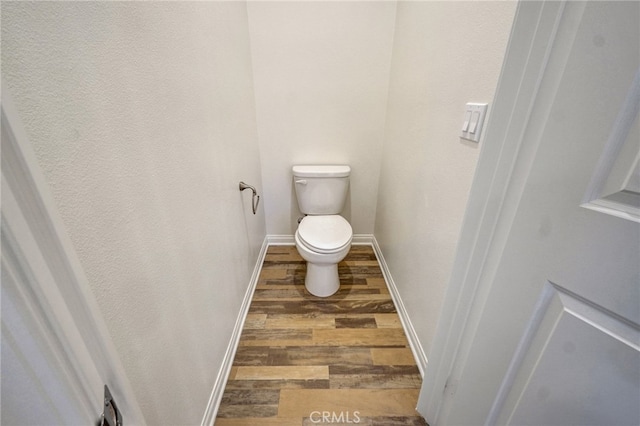 22824 W Olive Way, Canoga Park, CA 91304 - bathroom with toilet, baseboards, and wood finished floors