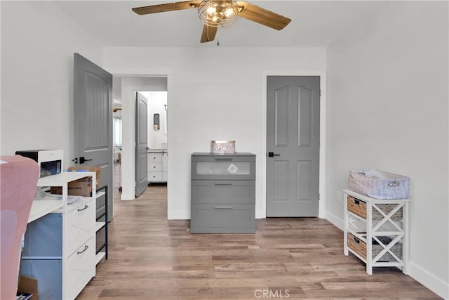 10634 Mesquite St, Oak Hills, CA 92344 - bedroom featuring baseboards, light wood-style floors, and ceiling fan