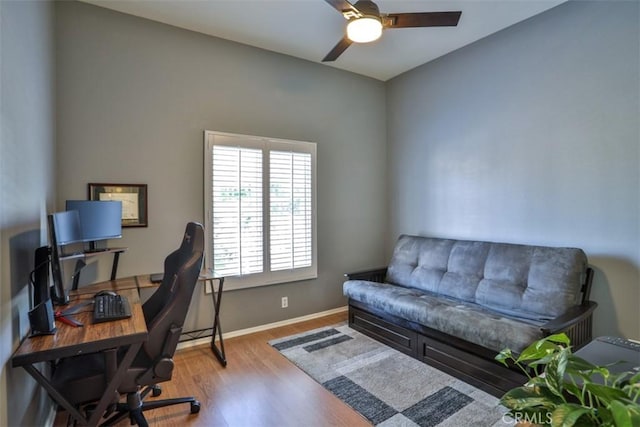 office with baseboards, ceiling fan, and wood finished floors