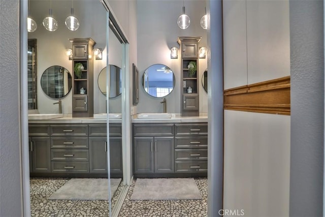 bathroom featuring tile patterned flooring and vanity