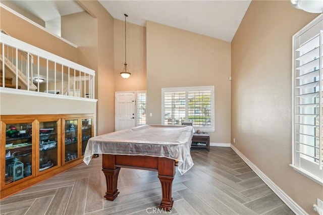 playroom with baseboards, high vaulted ceiling, billiards, and a wealth of natural light