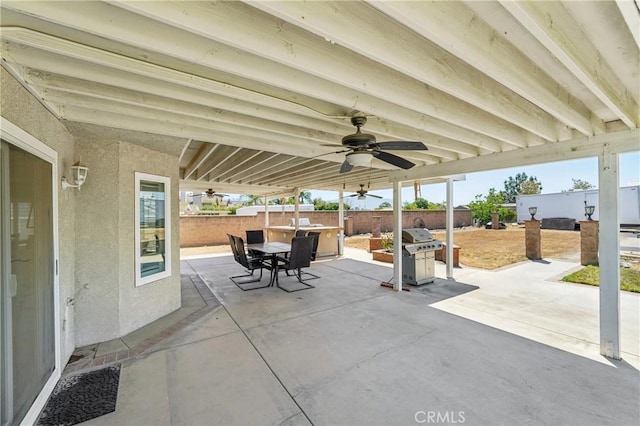 view of patio featuring a fenced backyard, ceiling fan, a grill, and outdoor dining space