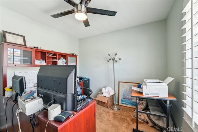 carpeted office with ceiling fan