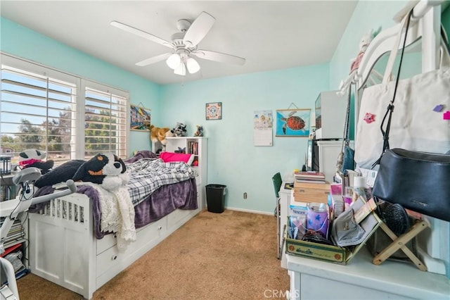 bedroom with baseboards, ceiling fan, and light carpet