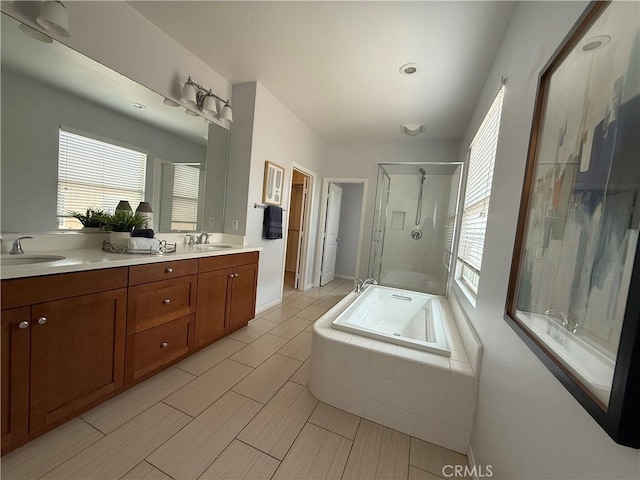 24 Flowerstalk, Irvine, CA 92618 - full bathroom with a shower stall, double vanity, plenty of natural light, and a garden tub