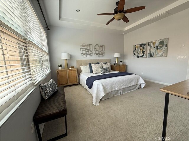 24 Flowerstalk, Irvine, CA 92618 - carpeted bedroom featuring a raised ceiling, baseboards, and ceiling fan
