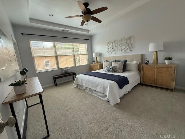 24 Flowerstalk, Irvine, CA 92618 - carpeted bedroom featuring a raised ceiling, baseboards, and a ceiling fan