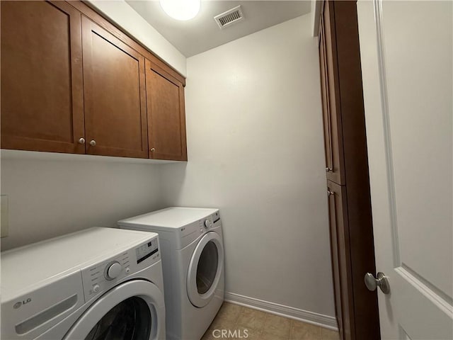 24 Flowerstalk, Irvine, CA 92618 - laundry area featuring cabinet space, washer and clothes dryer, baseboards, and light tile patterned floors