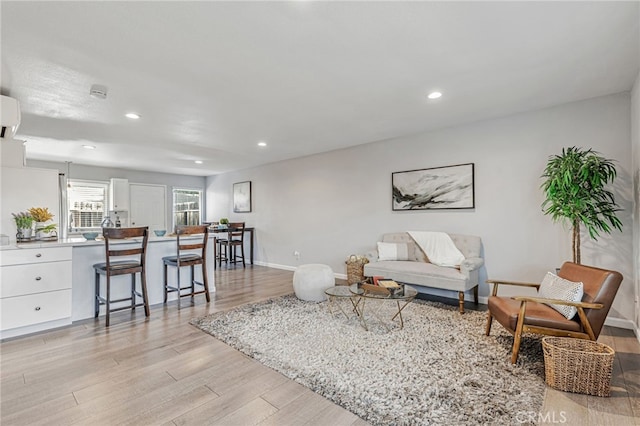 6633 Plymouth Rd, Stockton, CA 95207 - living area featuring light wood finished floors, recessed lighting, and baseboards