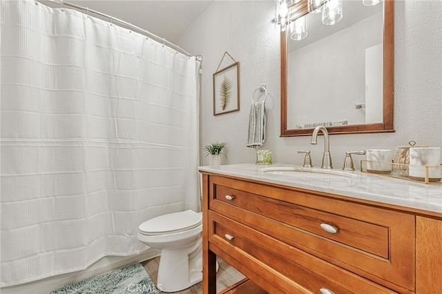 6633 Plymouth Rd, Stockton, CA 95207 - full bath with vanity, toilet, a textured wall, and a shower with curtain