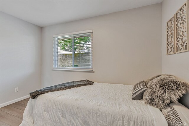 6633 Plymouth Rd, Stockton, CA 95207 - bedroom featuring wood finished floors and baseboards