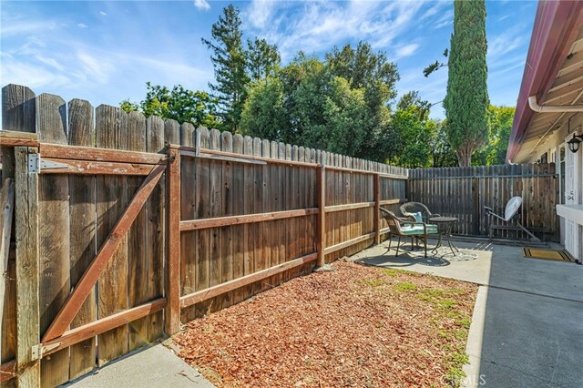 6633 Plymouth Rd, Stockton, CA 95207 - fenced backyard with a patio area