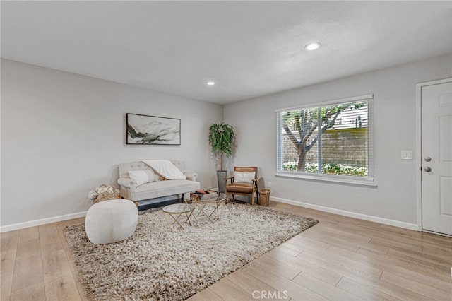 6633 Plymouth Rd, Stockton, CA 95207 - living room featuring light wood-style flooring, baseboards, and recessed lighting