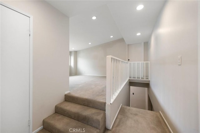 stairway with baseboards, carpet, and recessed lighting