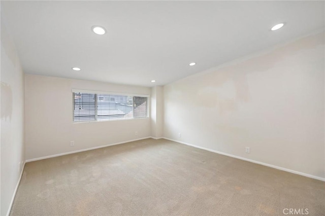 unfurnished room featuring carpet floors, recessed lighting, and baseboards