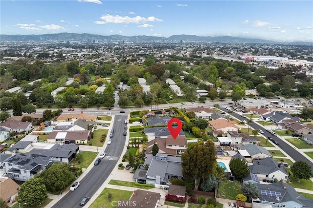 drone / aerial view featuring a residential view and a mountain view