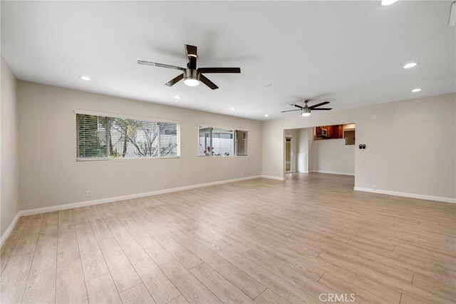spare room with a ceiling fan, recessed lighting, and light wood-style floors